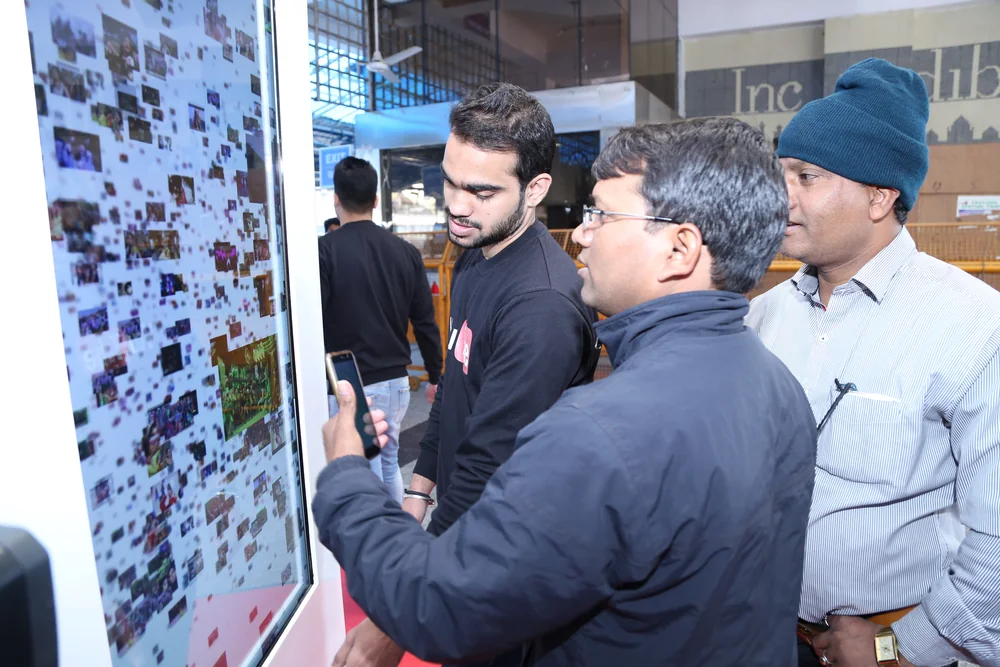 A steady crowd gathered around the YouTube Station kiosk on the concourse.